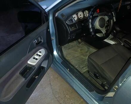 Зелений Міцубісі Lancer, об'ємом двигуна 2 л та пробігом 238 тис. км за 2999 $, фото 9 на Automoto.ua
