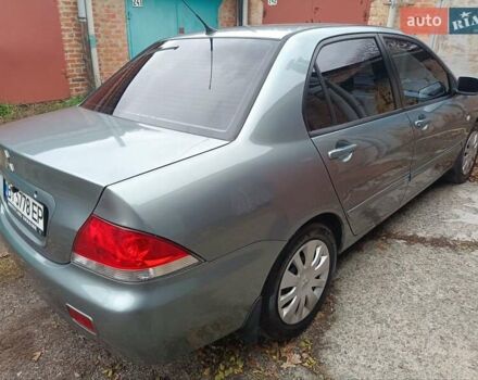 Зелений Міцубісі Lancer, об'ємом двигуна 1.6 л та пробігом 219 тис. км за 4700 $, фото 20 на Automoto.ua