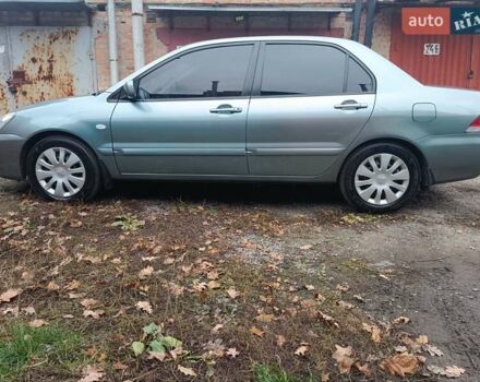 Зелений Міцубісі Lancer, об'ємом двигуна 1.6 л та пробігом 219 тис. км за 4700 $, фото 17 на Automoto.ua