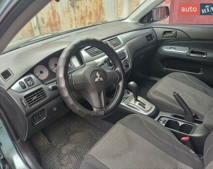 Зеленый Мицубиси Лансер, объемом двигателя 1.6 л и пробегом 219 тыс. км за 5300 $, фото 15 на Automoto.ua