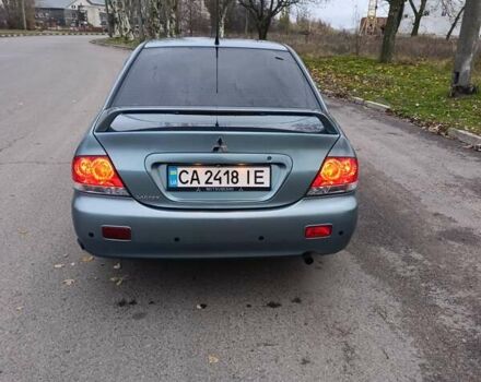 Зелений Міцубісі Lancer, об'ємом двигуна 1.6 л та пробігом 162 тис. км за 4700 $, фото 5 на Automoto.ua