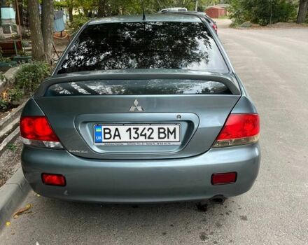 Зеленый Мицубиси Лансер, объемом двигателя 1.6 л и пробегом 255 тыс. км за 4000 $, фото 1 на Automoto.ua