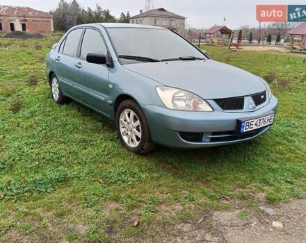 Зеленый Мицубиси Лансер, объемом двигателя 1.58 л и пробегом 300 тыс. км за 3999 $, фото 1 на Automoto.ua