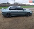 Зелений Міцубісі Lancer, об'ємом двигуна 2 л та пробігом 238 тис. км за 2999 $, фото 4 на Automoto.ua