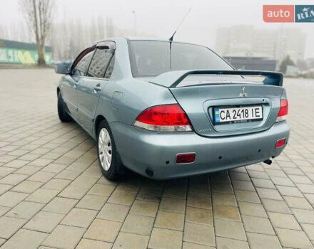 Зеленый Мицубиси Лансер, объемом двигателя 1.6 л и пробегом 164 тыс. км за 5000 $, фото 1 на Automoto.ua