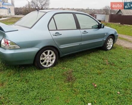 Зеленый Мицубиси Лансер, объемом двигателя 1.58 л и пробегом 300 тыс. км за 3999 $, фото 2 на Automoto.ua