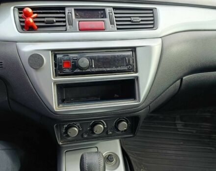 Зелений Міцубісі Lancer, об'ємом двигуна 2 л та пробігом 238 тис. км за 3400 $, фото 7 на Automoto.ua