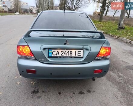 Зелений Міцубісі Lancer, об'ємом двигуна 1.6 л та пробігом 162 тис. км за 4700 $, фото 12 на Automoto.ua