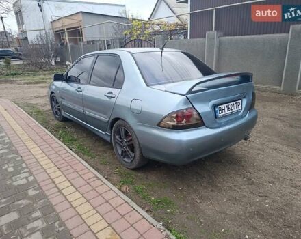 Зелений Міцубісі Lancer, об'ємом двигуна 2 л та пробігом 238 тис. км за 2999 $, фото 2 на Automoto.ua
