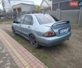 Зелений Міцубісі Lancer, об'ємом двигуна 2 л та пробігом 238 тис. км за 2999 $, фото 2 на Automoto.ua