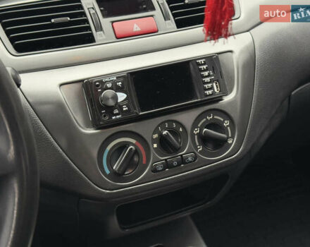 Зеленый Мицубиси Лансер, объемом двигателя 1.6 л и пробегом 214 тыс. км за 4150 $, фото 21 на Automoto.ua