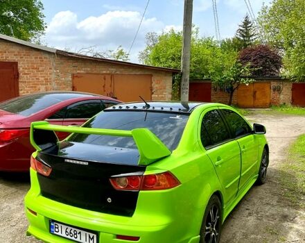 Зелений Міцубісі Lancer, об'ємом двигуна 2 л та пробігом 227 тис. км за 7200 $, фото 4 на Automoto.ua