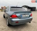 Зеленый Мицубиси Лансер, объемом двигателя 1.6 л и пробегом 240 тыс. км за 4500 $, фото 1 на Automoto.ua