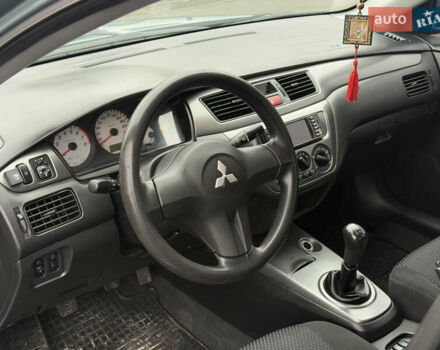 Зеленый Мицубиси Лансер, объемом двигателя 1.6 л и пробегом 214 тыс. км за 4150 $, фото 13 на Automoto.ua