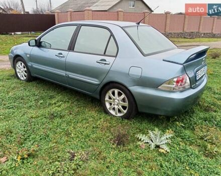 Зеленый Мицубиси Лансер, объемом двигателя 1.58 л и пробегом 300 тыс. км за 3999 $, фото 3 на Automoto.ua