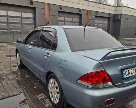 Зеленый Мицубиси Лансер, объемом двигателя 1.6 л и пробегом 165 тыс. км за 5500 $, фото 7 на Automoto.ua