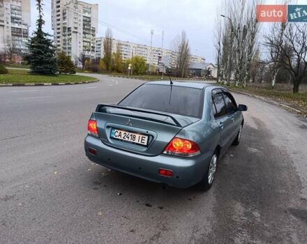 Зелений Міцубісі Lancer, об'ємом двигуна 1.6 л та пробігом 162 тис. км за 4700 $, фото 8 на Automoto.ua