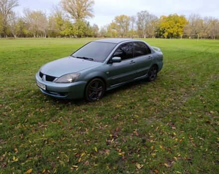 Зелений Міцубісі Lancer, об'ємом двигуна 2 л та пробігом 238 тис. км за 3400 $, фото 4 на Automoto.ua