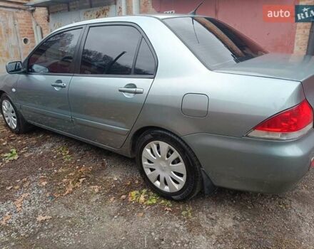 Зелений Міцубісі Lancer, об'ємом двигуна 1.6 л та пробігом 219 тис. км за 4700 $, фото 16 на Automoto.ua