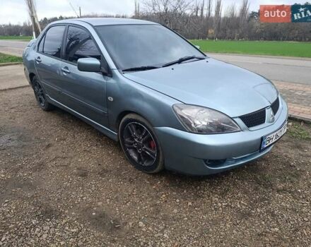 Зелений Міцубісі Lancer, об'ємом двигуна 2 л та пробігом 238 тис. км за 2999 $, фото 1 на Automoto.ua