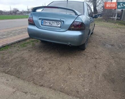 Зелений Міцубісі Lancer, об'ємом двигуна 2 л та пробігом 238 тис. км за 2999 $, фото 5 на Automoto.ua