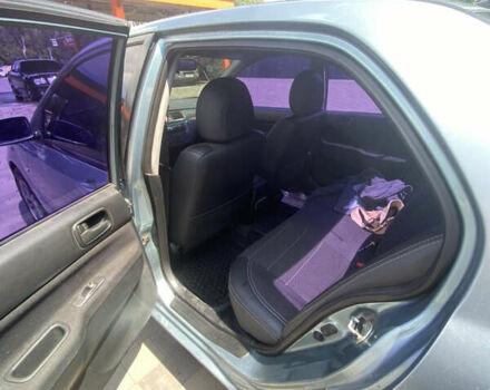 Зелений Міцубісі Lancer, об'ємом двигуна 1.58 л та пробігом 220 тис. км за 4500 $, фото 9 на Automoto.ua