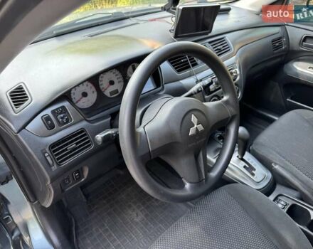 Зеленый Мицубиси Лансер, объемом двигателя 1.6 л и пробегом 137 тыс. км за 5500 $, фото 25 на Automoto.ua