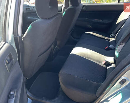 Зеленый Мицубиси Лансер, объемом двигателя 1.58 л и пробегом 180 тыс. км за 4800 $, фото 7 на Automoto.ua