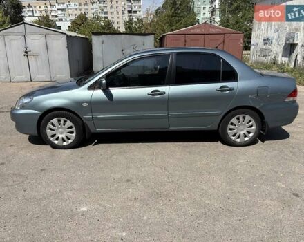 Зеленый Мицубиси Лансер, объемом двигателя 1.58 л и пробегом 212 тыс. км за 5100 $, фото 8 на Automoto.ua