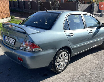 Зеленый Мицубиси Лансер, объемом двигателя 1.58 л и пробегом 180 тыс. км за 4800 $, фото 5 на Automoto.ua