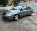 Зелений Міцубісі Lancer, об'ємом двигуна 1.58 л та пробігом 200 тис. км за 4200 $, фото 1 на Automoto.ua