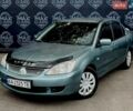 Зеленый Мицубиси Лансер, объемом двигателя 1.59 л и пробегом 230 тыс. км за 3900 $, фото 1 на Automoto.ua