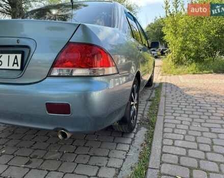 Зеленый Мицубиси Лансер, объемом двигателя 1.6 л и пробегом 137 тыс. км за 5500 $, фото 30 на Automoto.ua