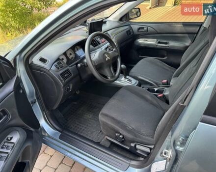 Зеленый Мицубиси Лансер, объемом двигателя 1.6 л и пробегом 137 тыс. км за 5500 $, фото 24 на Automoto.ua