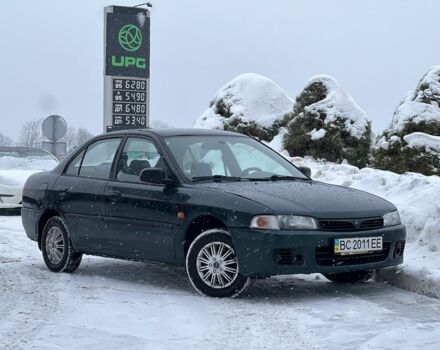 Зеленый Мицубиси Лансер, объемом двигателя 1.3 л и пробегом 259 тыс. км за 2349 $, фото 1 на Automoto.ua