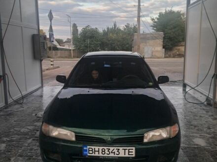 Зеленый Мицубиси Лансер, объемом двигателя 1.3 л и пробегом 400 тыс. км за 2300 $, фото 1 на Automoto.ua