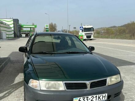 Зелений Міцубісі Lancer, об'ємом двигуна 0.13 л та пробігом 230 тис. км за 1999 $, фото 1 на Automoto.ua