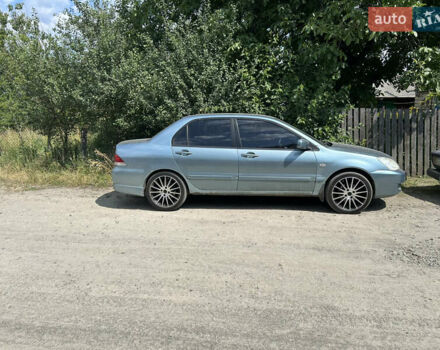 Зелений Міцубісі Lancer, об'ємом двигуна 1.58 л та пробігом 306 тис. км за 4400 $, фото 1 на Automoto.ua