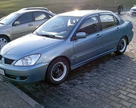 Зеленый Мицубиси Лансер, объемом двигателя 1.58 л и пробегом 244 тыс. км за 4900 $, фото 1 на Automoto.ua