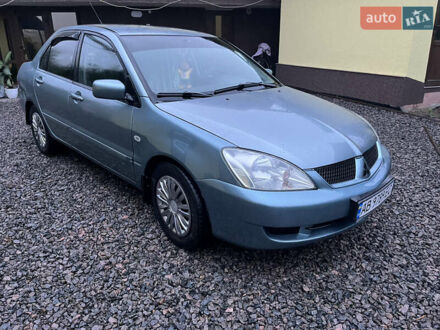 Зелений Міцубісі Lancer, об'ємом двигуна 1.58 л та пробігом 252 тис. км за 3650 $, фото 1 на Automoto.ua