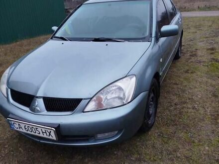 Зеленый Мицубиси Лансер, объемом двигателя 1.58 л и пробегом 224 тыс. км за 3500 $, фото 1 на Automoto.ua