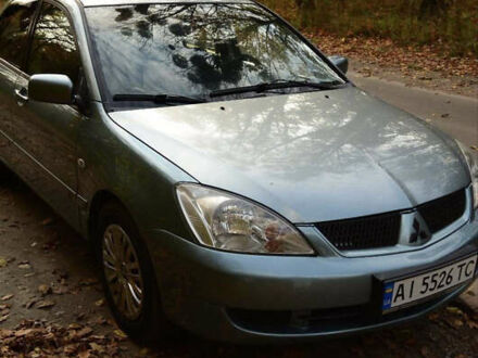 Зеленый Мицубиси Лансер, объемом двигателя 1.58 л и пробегом 259 тыс. км за 4300 $, фото 1 на Automoto.ua
