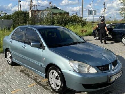 Зелений Міцубісі Lancer, об'ємом двигуна 1.58 л та пробігом 100 тис. км за 4800 $, фото 1 на Automoto.ua