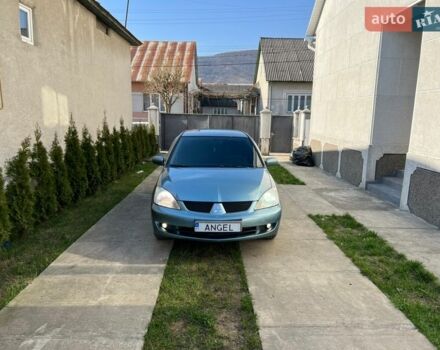 Зеленый Мицубиси Лансер, объемом двигателя 1.58 л и пробегом 240 тыс. км за 3000 $, фото 1 на Automoto.ua