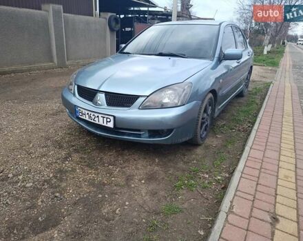 Зелений Міцубісі Lancer, об'ємом двигуна 2 л та пробігом 238 тис. км за 2999 $, фото 1 на Automoto.ua