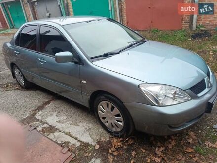 Зеленый Мицубиси Лансер, объемом двигателя 1.6 л и пробегом 219 тыс. км за 5300 $, фото 1 на Automoto.ua