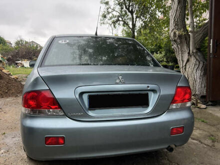 Зеленый Мицубиси Лансер, объемом двигателя 1.6 л и пробегом 217 тыс. км за 5400 $, фото 1 на Automoto.ua