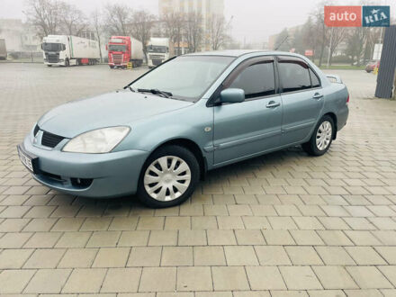 Зеленый Мицубиси Лансер, объемом двигателя 1.6 л и пробегом 164 тыс. км за 5000 $, фото 1 на Automoto.ua