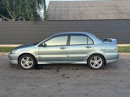 Зелений Міцубісі Lancer, об'ємом двигуна 2 л та пробігом 166 тис. км за 4800 $, фото 1 на Automoto.ua