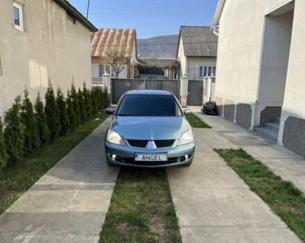 Зеленый Мицубиси Лансер, объемом двигателя 1.6 л и пробегом 240 тыс. км за 3000 $, фото 1 на Automoto.ua